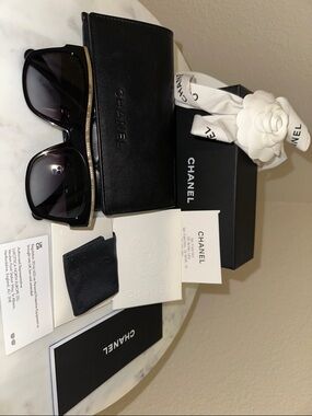 CHANEL Black Sunglasses with Gold Logo Trim